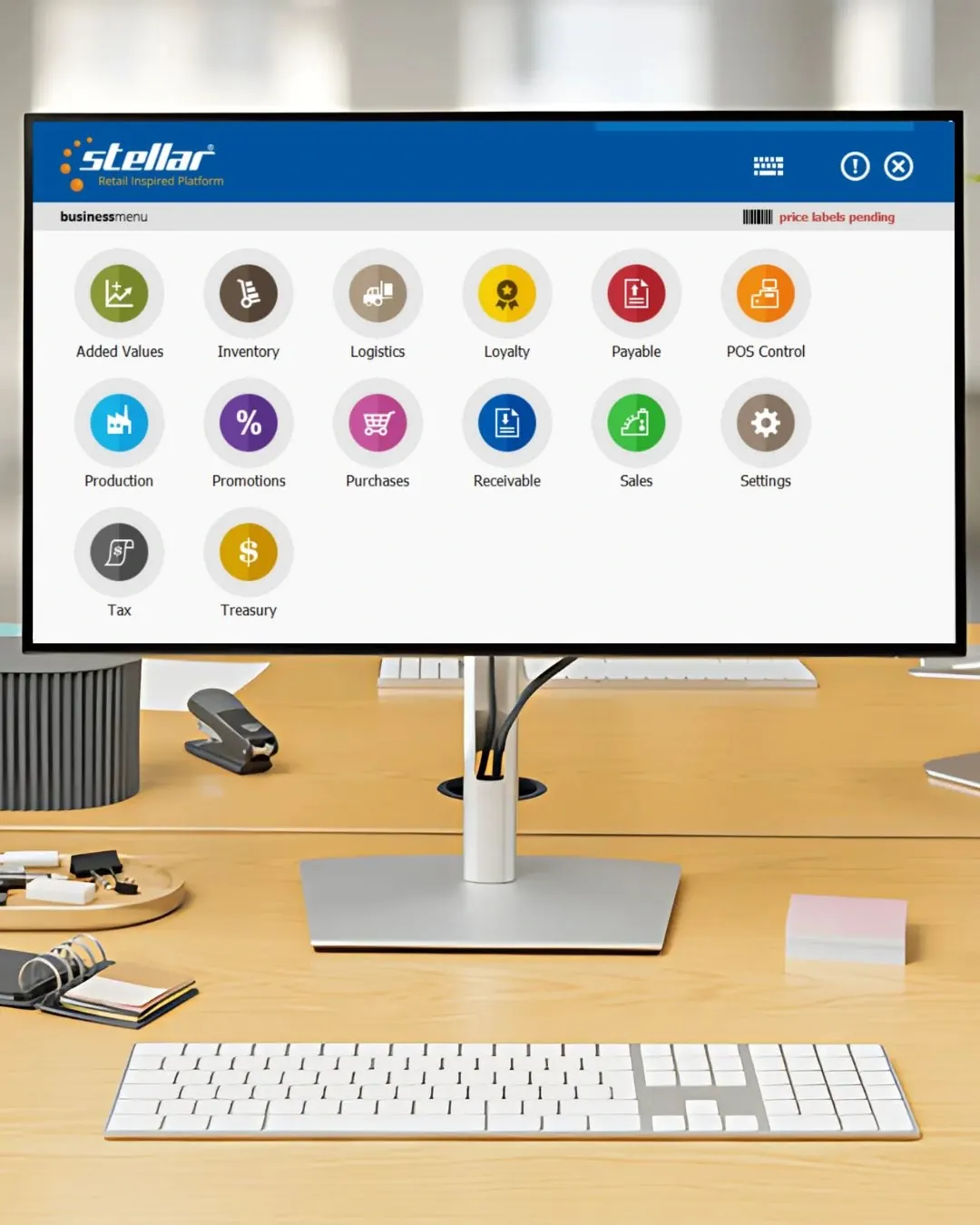 Stellar BUSINESS en un monitor con su menú de compras, inventario, producción, cuentas y tesorería